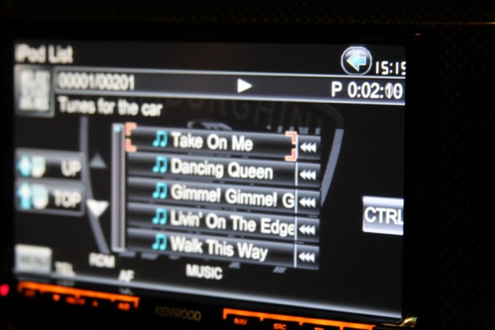 Lose Loud Licence Music Pistonheads - This image shows a screen of a music player interface displaying "iPod List" with music tracks visible, including songs like "Take On Me," "Dancing Queen," "Gimmel Gimmel," "Living' On The Edge," and "Walk This Way" by different artists, along with the album "Music" by AC/DC. The screen indicates the following: "00:11:00021" (which likely represents the current time), "P P 02:00" (potentially for pause or play status), "CTRL" (which could be a button for control, options, or settings), and "Next" for advancing to the next track. The interface is minimalist and simple, with a dark color theme, which is typical for modern electronic devices.