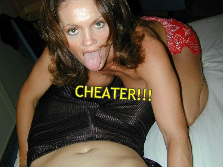 A woman sitting on a bed holding a book - Utah Cheating Slut George Magna Ollerton Elaine