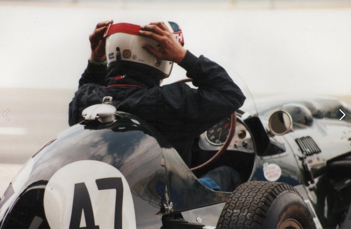 Post an interesting picture from your image folder - Page 19 - Photography & Video - PistonHeads - The image captures a dynamic scene on a racetrack. At the center of the frame, a man donned in a helmet is cradling his head with one hand, sitting in the cockpit of a white race car. His hand rests lightly on the steering wheel, ready to navigate the course. The car's sleek design, visible through the glass and windshield, contrasts with the black helmet he is wearing, adding to the intensity of the moment. The blurred background suggests motion, emphasizing the speed and action inherent in this high-stakes racing event.