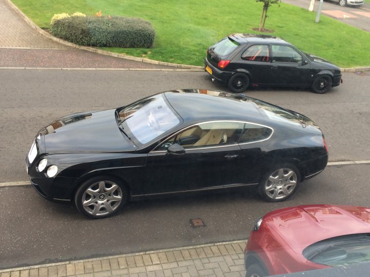 A car is parked next to a parking meter - Pistonheads