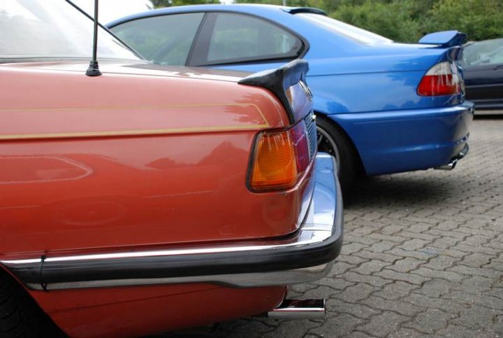 Service Sunday Pistonheads - The image showcases a serene parking lot scene, where two cars are parked in a diagonal manner. The first car is a striking red color, while the second car, placed behind it, is a vibrant blue. The cars are parked close to each other, almost overlapping their respective bumpers. The license plates of the cars are clearly visible, adding to the authenticity of the scene. The setting seems peaceful, with no visible movement or activity in the background.