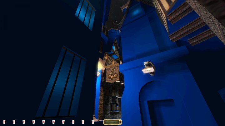 A large clock mounted to the side of a building - The image is a screenshot from a video game, which appears to be a first-person perspective game. The player's viewpoint is through the eyes of an avatar that seems to be in a building or room with a blue floor and walls, possibly indicating a specific theme or area within the game environment.

The ceiling has a grid-like structure, suggesting it might be part of the game's architecture or decoration. There are three different items present on the floor: a red object that could be a puzzle piece or a collectible item, a blue item resembling a crate or box, and another red item near the edge of the image.

The avatar is equipped with what appears to be a backpack or satchel, which might contain additional items or equipment for the player to use within the game. The overall impression is that this is a scene from an exploration or puzzle-solving segment in the game.