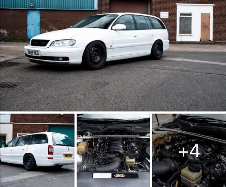 A car parked next to a parking meter - Pistonheads - The image shows a white car parked in front of a building, which appears to be a garage. The car is positioned at an angle and has a noticeable dent on its side door. It's a compact vehicle with visible wheel arches and a distinct design. In the foreground, there are several objects that look like automotive parts or tools, such as what seems to be a suspension or exhaust component and possibly a car jack. The photo is taken in a way that captures these items and the vehicle in one frame, creating a narrative of an ongoing repair process.