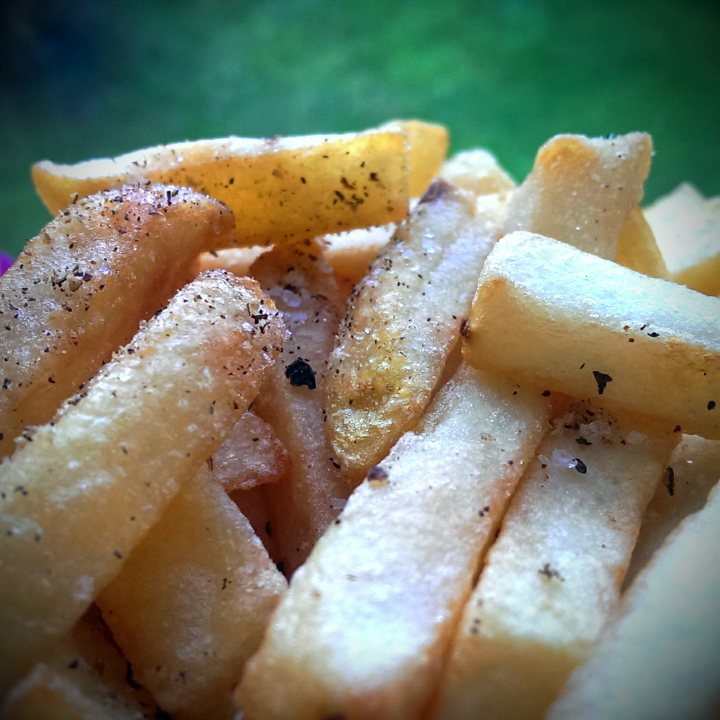 A close up of a plate of food with french fries - Pistonheads