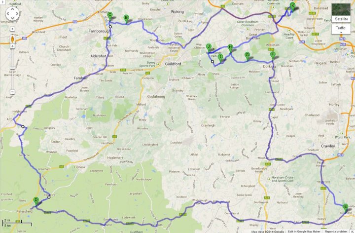 Sunday morning drive in Surrey - map included - Page 1 - Roads - PistonHeads - The image is a map showing a bike route through an area with many trails and roads. The map is predominantly white with varying shades representing different types of paths. Green circles indicate specific points of interest or stops along the route. The map seems to zoom in close to a particular section of the trail with more detailed information. In the top left corner, there appears to be a legend or key with symbols and their corresponding meanings. There's also a small set of handles or controls located at the top right corner. The style of the map is typical of cycling or outdoor recreation maps, designed to be both easily readable and informative.