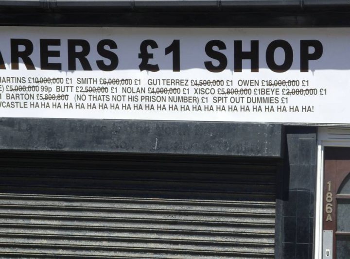 Pistonheads - The image showcases a sign advertising a "Shop for Pawned Jewelry", indicating that one can find "Martins" at an affordable price of E60,000-$69,000 per ounce. It also mentions Guitars for E30,000-$45,000, pawned or in police custody yet available for sale. However, warning potential buyers, the shop advises to be cautious due to high instances of purchased items being undesirable when it comes to "Bartrum-Like Number Problems", "In that they cannot hold their prison number #100", and does not capitulate to selling items with funny looks or being "that weird". At the bottom, the shop encourages buyers, highlighting the potential for purchasing unique gems such as emeralds and rubies, for a price of E5,000-$6,000 per ounce.