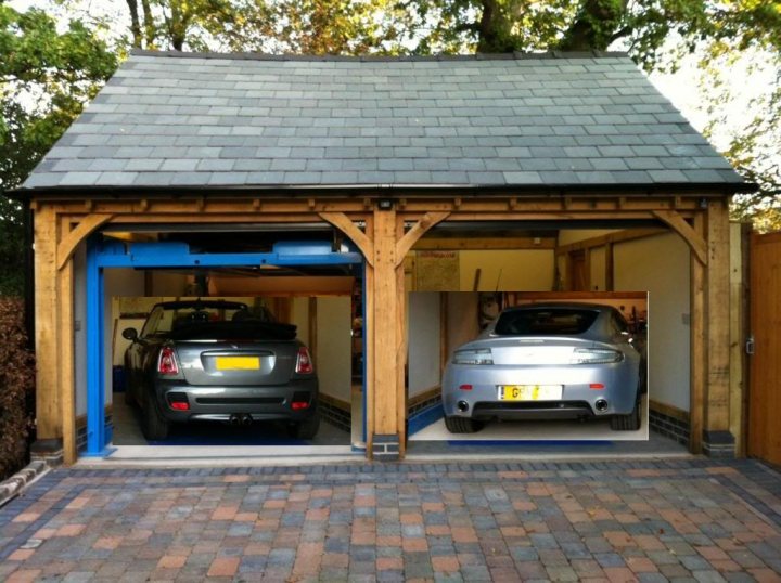 Garage Queens - Page 9 - Aston Martin - PistonHeads - The image shows two cars parked inside a garage. The garage has a wooden pressing structure designed to lift vehicles for maintenance or repairs. The garage has a clean and organized appearance. In the foreground, the ground appears to be paved with an interlocking pattern.