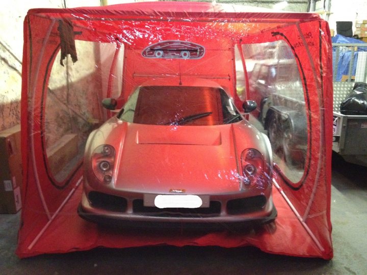 A close up of a red motorcycle parked in a parking lot - Pistonheads