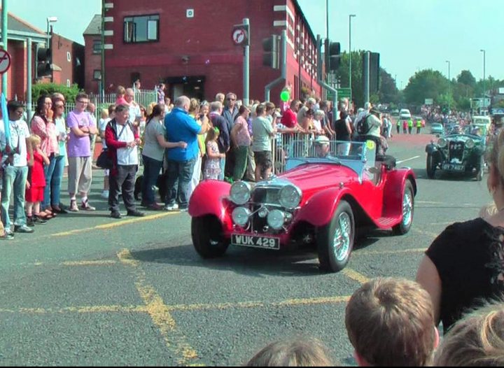 A group of people standing around a truck - Pistonheads