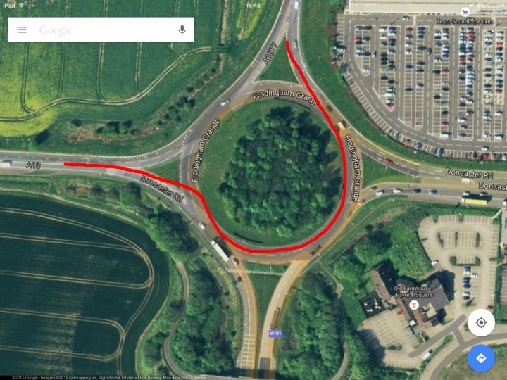 Road rage; is it getting worse? - Page 9 - General Gassing - PistonHeads - The image is a screenshot from a smartphone running a map application, displaying a section of roadways symbolically with a large red circle highlighting a specific section. The red circle seems to be indicating a road construction zone, possibly near Frodingham Grange. Surrounding the highlighted area, there's a rich green landscape, and the roads show various directions and different types of connections. There's a subtle gradient of colors on the map, gradually transitioning from green to gray, likely to signify varying levels of detail or importance within the area. At the bottom of the screen, we can see a gray navigation bar with the country's local icons, suggesting that the language is English and the country's standard occupation for the title "Look" is being used as a local term.