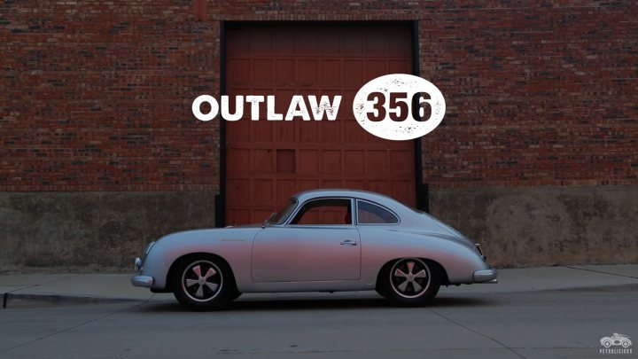 Pictures of decently Modified cars [Vol. 2] - Page 175 - General Gassing - PistonHeads - The image features a vintage car, prominently a Porsche 356, parked in front of a red brick wall that has a large archway. The wall's texture is clearly visible, with the bricks appearing in various shades of red. The car is positioned facing the wall, highlighting the archway. On the wall, in a distressed font style that resembles graffiti or stickers, are the letters "Outlaw 356" against a white background, which suggests that the car might be associated with an outlaw group or garages sympathetic to automotive culture. The image has a cinematic quality, possibly hinting at being used as a backdrop or promotional material.