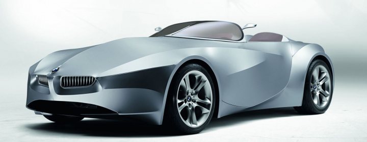 Design Sketches Kitcar Pistonheads Concepts - The image features a sleek, silver sports car with distinctive curved lines and a low, wide stance. The car has large alloy wheels and the design hints at aerodynamics. There is a hint of a hood and grille, suggesting the front of the car is visible. The image is likely a professional photograph intended to showcase the vehicle's design and appeal. There are no visible texts or brands in the image.