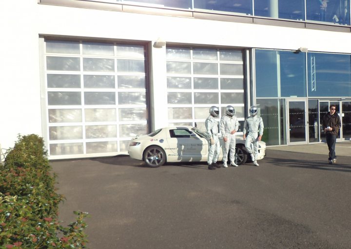 A white truck parked in front of a building - Pistonheads