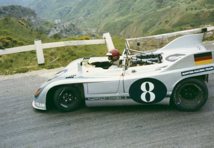 A few pictures I quite like - please add to it ...... - Page 6 - Porsche General - PistonHeads - The image showcases a professional race car in action on a road. The car is white and black, possibly a Martini Racing Team car, with the number 8 prominently displayed on its side. There's also a glimpse of another car behind, suggesting a racing context, and a backdrop of a mountainous landscape with green trees and bushes, implying that the race might be taking place in a rural or semi-rural area. The overall scene captures the adrenaline and excitement of competitive motor racing.