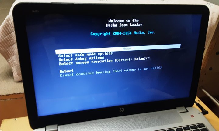 A close up of a tv with a video game - The image shows a laptop screen with the title "Welcome to the New World" displayed in bold letters at the top. Below this, there is a command prompt window open, and it appears that the user is in a process of setting up a Windows operating system, as indicated by the messages on the screen. There are options such as "Select your location," "Install now," and various buttons like "Change time zone" and "Sign in." The laptop itself is a silver color and appears to be a modern model with a sleek design. It's placed on what looks like a white surface, possibly a table or desk.