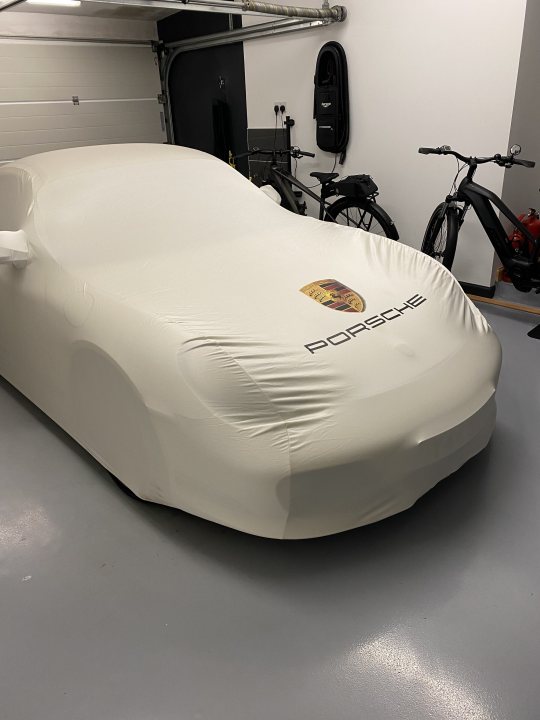 A white bed with a black and white cover - Pistonheads
