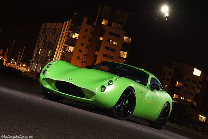 Tvr Colour Pistonheads Perfect - In the dark, a lime green sports car is parked on a deserted street, its sleek lines accentuated by the contrast of the black tires. The car's vibrant color stands out starkly against the night sky. In the background, a building with multiple lights can be seen, casting an ambient glow that highlights the car's reflective surface. Surprisingly, a helicopter is captured mid-flight in the upper right corner of the frame, adding an element of excitement and mystery to the scene. All these elements combine to create a dynamic and intriguing nighttime streetscape.