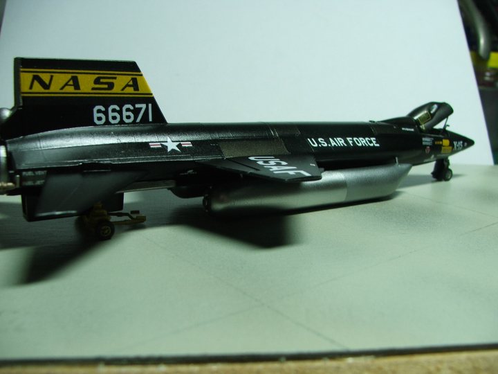 Revell/Monogram North American X-15 1/72 - Page 1 - Scale Models - PistonHeads - The image showcases a highly detailedmodel of a black U.S. Air Force fighter jet. The model is specifically a VF-1 fighter jet, as indicated by the text on the front. It's painted with a "6671" number, which is also visible on the tail. The jet is equipped with imaginary missiles that the modeler has added. It's seated on a white table, ready to take off. The meticulous craftsmanship is evident in the photo, making it a realistic and intricate representation of the real-life aircraft.