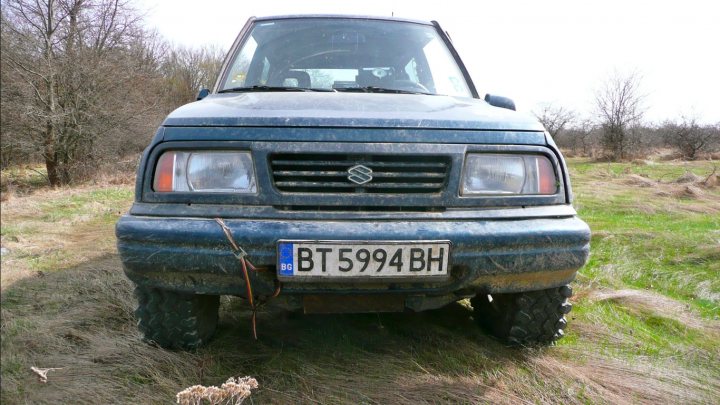 Couple of pics from today... - Page 1 - Off Road - PistonHeads - The image shows an older model SUV parked on a field, facing towards the right side of the frame. It is colored in shades of blue and black, with a prominent license plate that reads "BT5994 BH". The vehicle appears to be from the era of the late 1990s to early 2000s, judging by the design of the headlights, the shape of the grille, and the overall aesthetic. The background is a natural, outdoor landscape with grassy areas and trees with no leaves on them, suggesting the photo might have been taken in autumn or winter. The atmosphere of the image conveys a sense of tranquility and possibly, adventure.