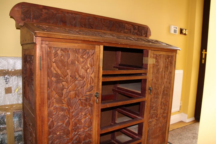 A large wooden grandfather clock sitting in a room - Pistonheads