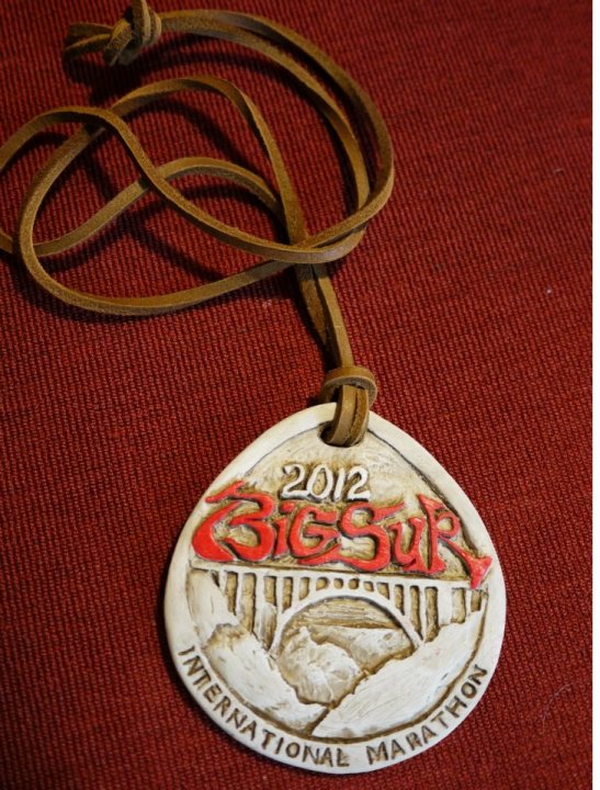 A close up of a pair of scissors - Pistonheads - The image showcases a medal that appears to be from a race. The medal is white with gold detailing and is fashioned into a round shape. Prominently displayed on the metal is the year "2012" in bold letters, suggesting this could be a commemorative piece from a specific year. Additionally, there's text that reads "Big Event" and "International Marathon," indicating that this medal could be from a significant, large-scale race event. The medal is attached to a red fabric strip by a string, which is commonly used to show runner numbers during such events.