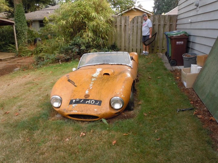 A red fire hydrant sitting in the middle of a field - Pistonheads