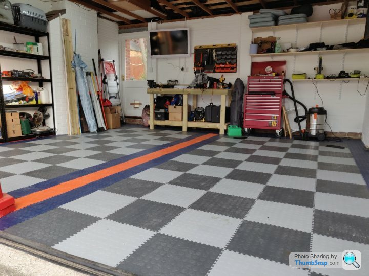 I unrolled My Garage Floor Mat and It Won't Lay Flat