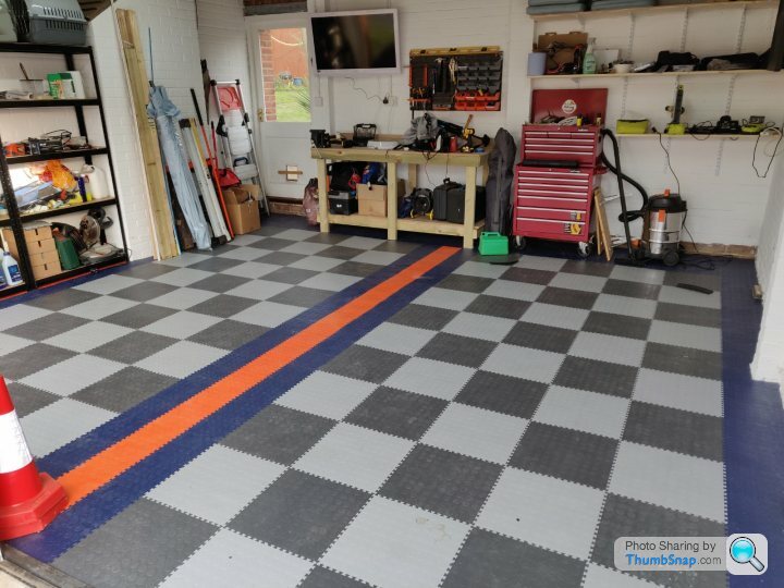 I unrolled My Garage Floor Mat and It Won't Lay Flat