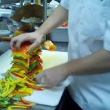 Chef slices 15 bell peppers at once.