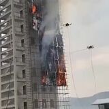 Fire fighting drones effectively putting out a controlled building fire