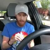 Opening a can of surströmming in a car.