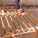 Casting a fence in a sand mold.