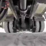 A neat snow chain deployment system to help cars and trucks get better traction on slippery surfaces