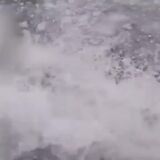 INTENSE: Watch as a Coast Guard leaps onto a moving submarine off the coast o...