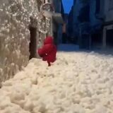 Spanish street filled with foam after a storm