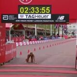 Hayley Carruthers collapses from exhaustion right at the finish line of the 2019 London Marathon