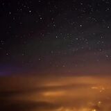 A pilot filmed his descent through the clouds and into a beautiful city at night